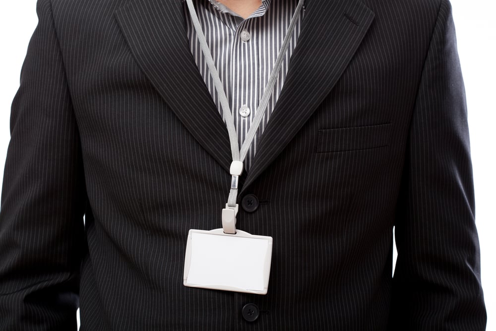 Businessman with empty id card on his neck